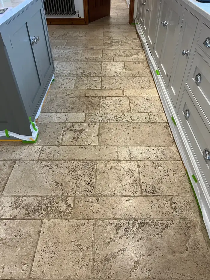 Restored tiled hallway floor in Rotherham after professional cleaning, shown before and after, before professional cleaning