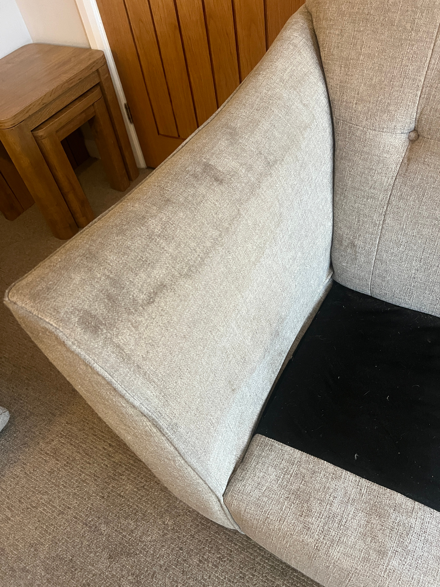 Stained sofa cushion cleaned in Rotherham, before professional cleaning