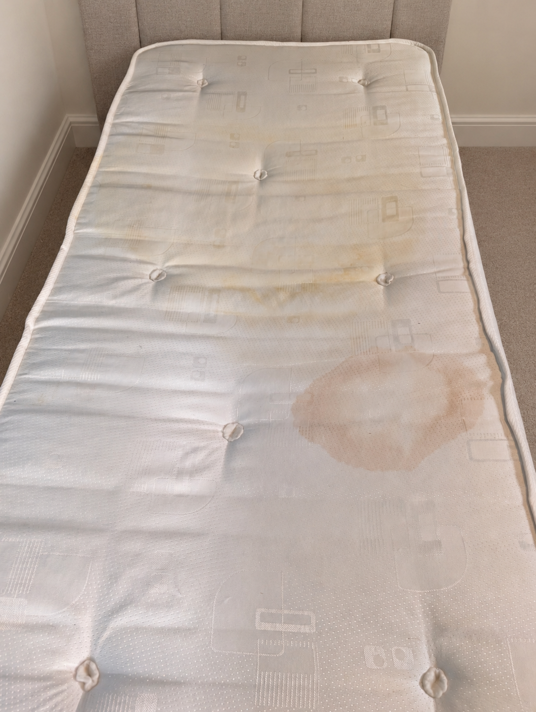 Stained mattress corner cleaned in Rotherham, before professional cleaning
