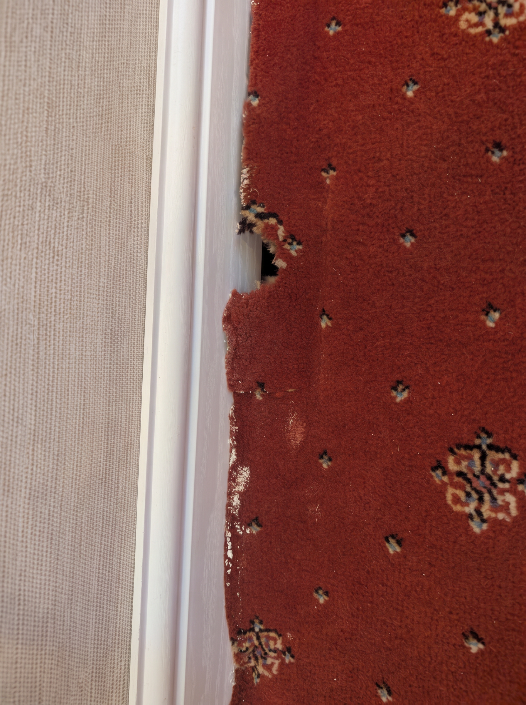 Carpet repair by a doorway in Rotherham, before professional cleaning